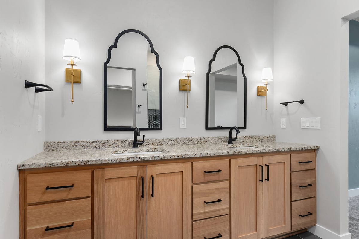 Double vanity with black mirrors in master bath by Midwest Design Homes in Harrison Wisconsin
