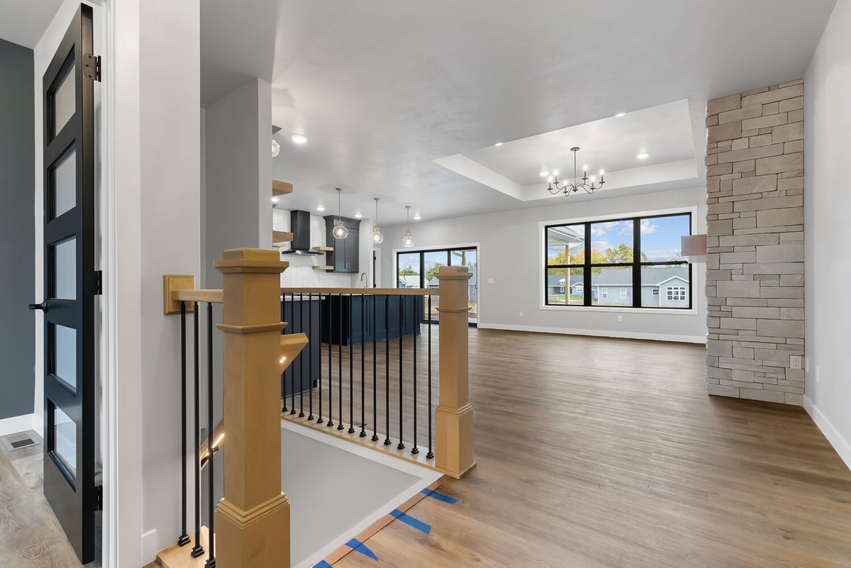 Entry view into modern open concept living area by Midwest Design Homes in Kaukauna, WI