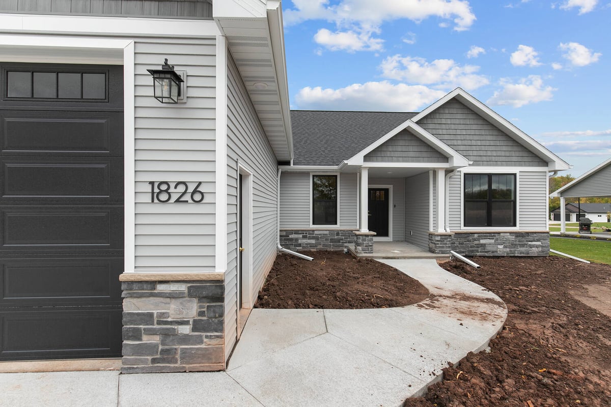 Entry walkway and front porch of new home by Midwest Design Homes in Fremont Wisconsin