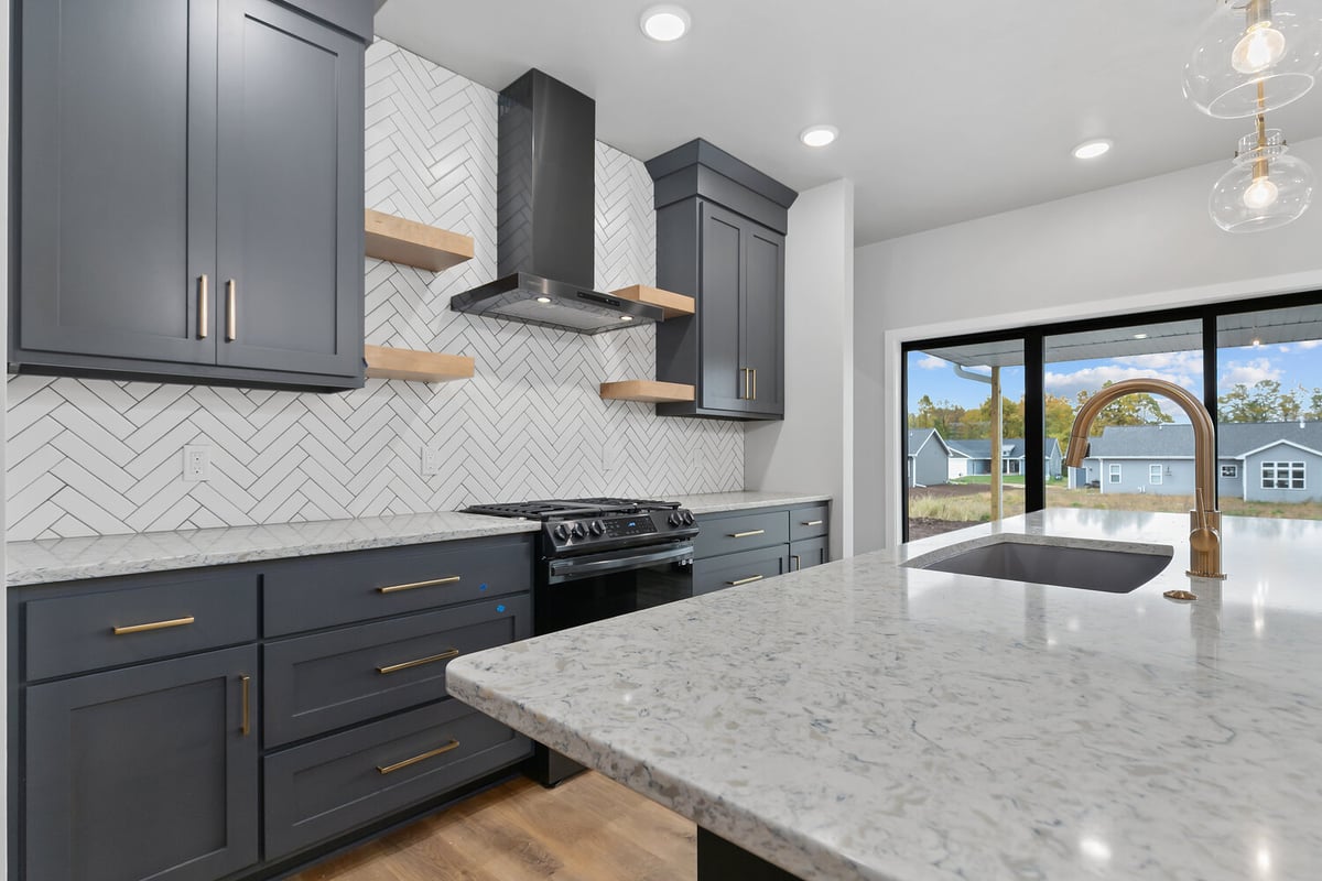 Kitchen countertop and stove detail in Kaukauna home by Midwest Design Homes