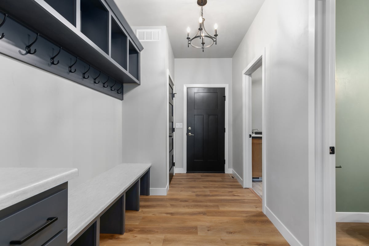 Long mudroom hallway with storage by Midwest Design Homes in custom Kaukauna home