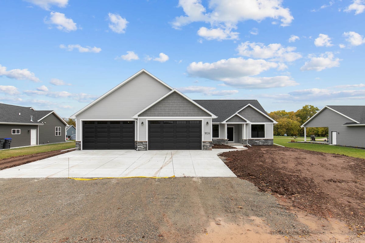 New construction home in Greenville WI by Midwest Design Homes with wide concrete driveway