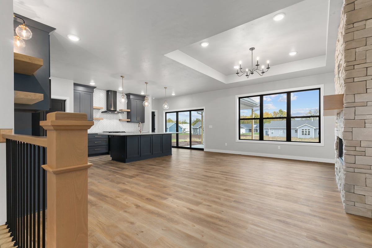 Open concept kitchen and living space in custom Kaukauna home by Midwest Design Homes