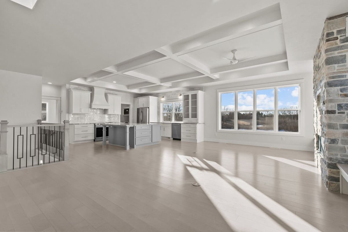 Kitchen and living space with coffered ceiling by Midwest Design Homes in Kaukauna, WI