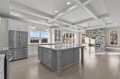 Large windows and kitchen island in a custom home by Midwest Design Homes in Wisconsin