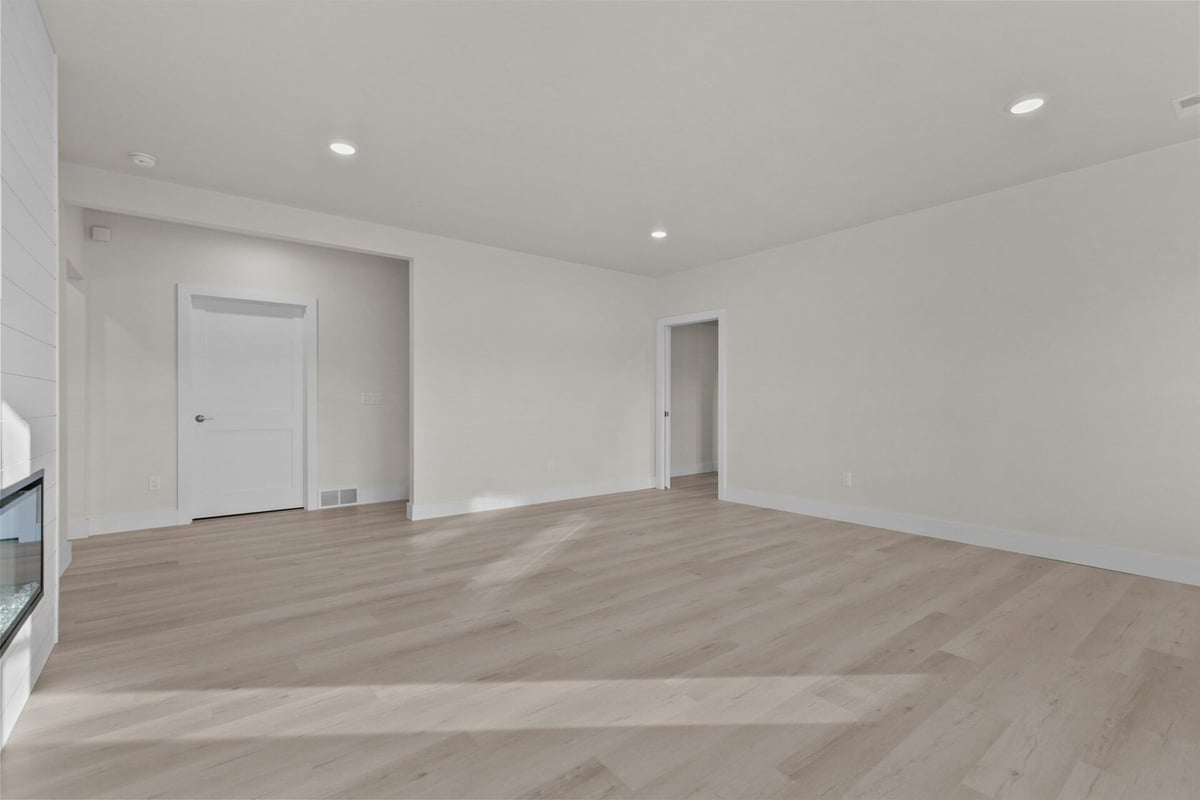 Light-toned empty living space in Wisconsin custom home by Midwest Design Homes