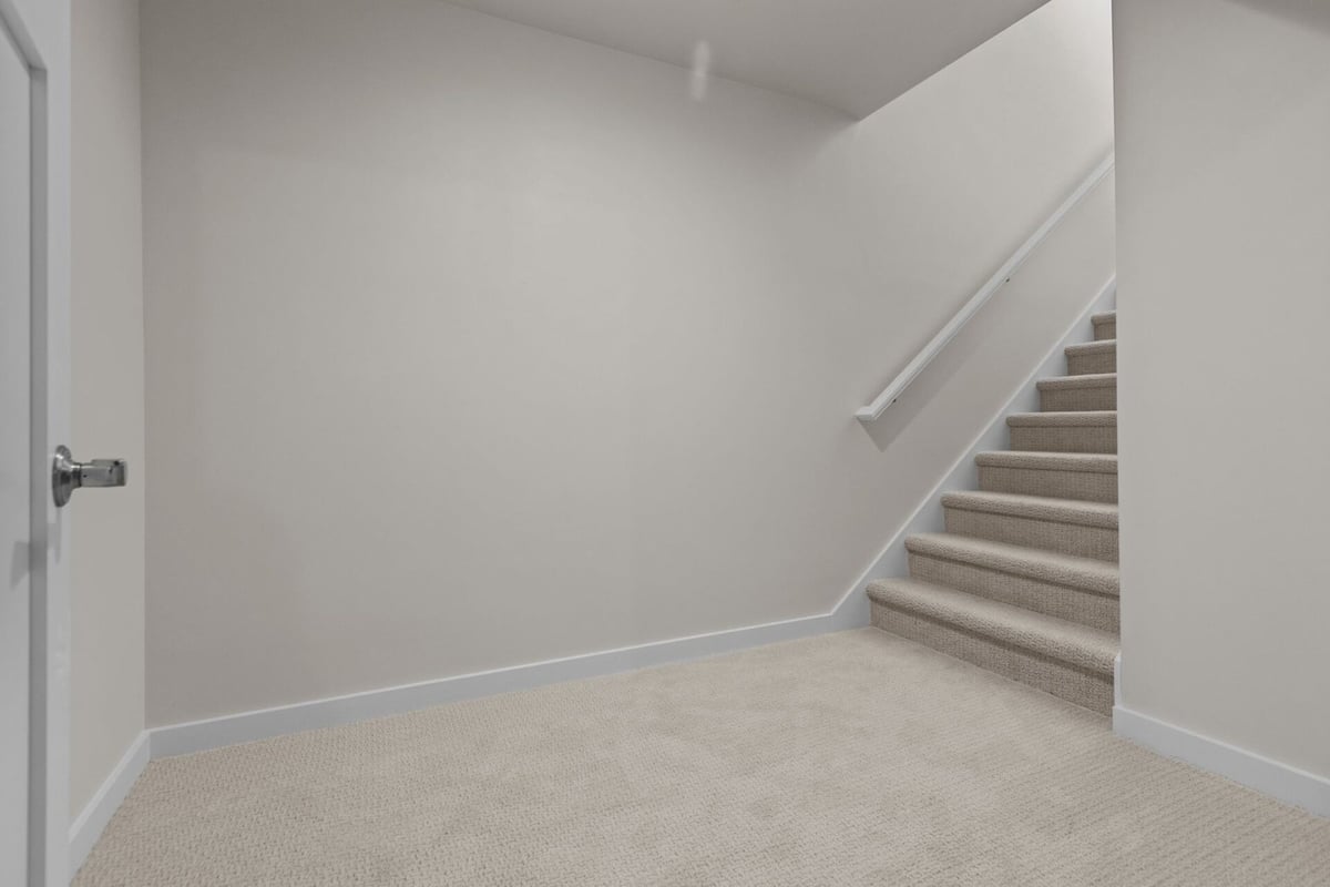 Carpeted stair landing in custom home by Midwest Design Homes in Kaukauna, Wisconsin