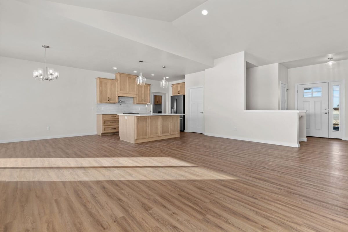 Kitchen with wood cabinetry and island by Midwest Design Homes in Ledgeview, Wisconsin