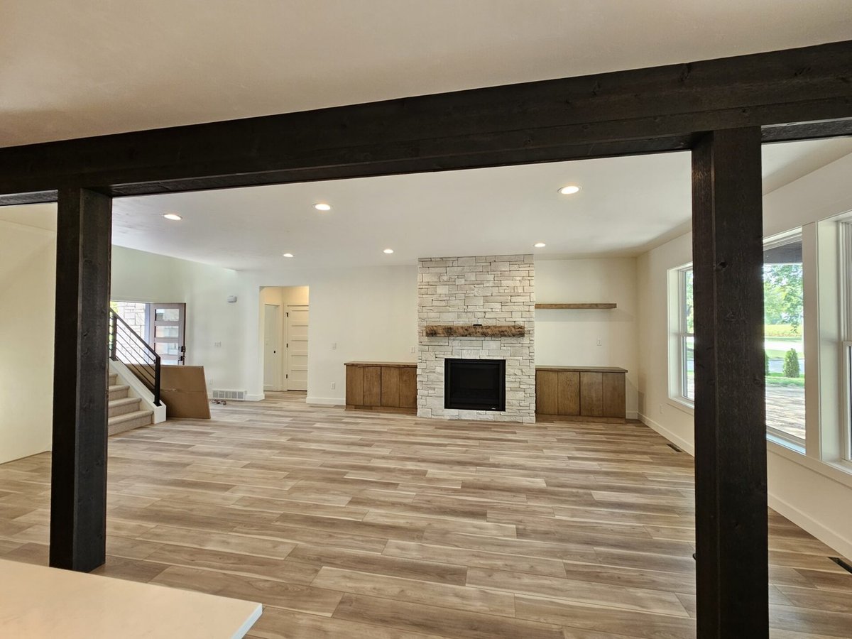 Living room with fireplace and wood built-ins by Midwest Design Homes in Kaukauna