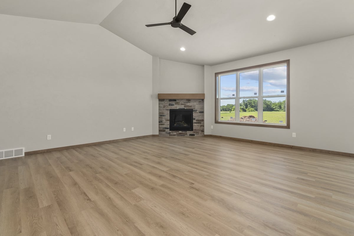 Bright and airy living space with scenic views in Wisconsin home by Midwest Design Homes