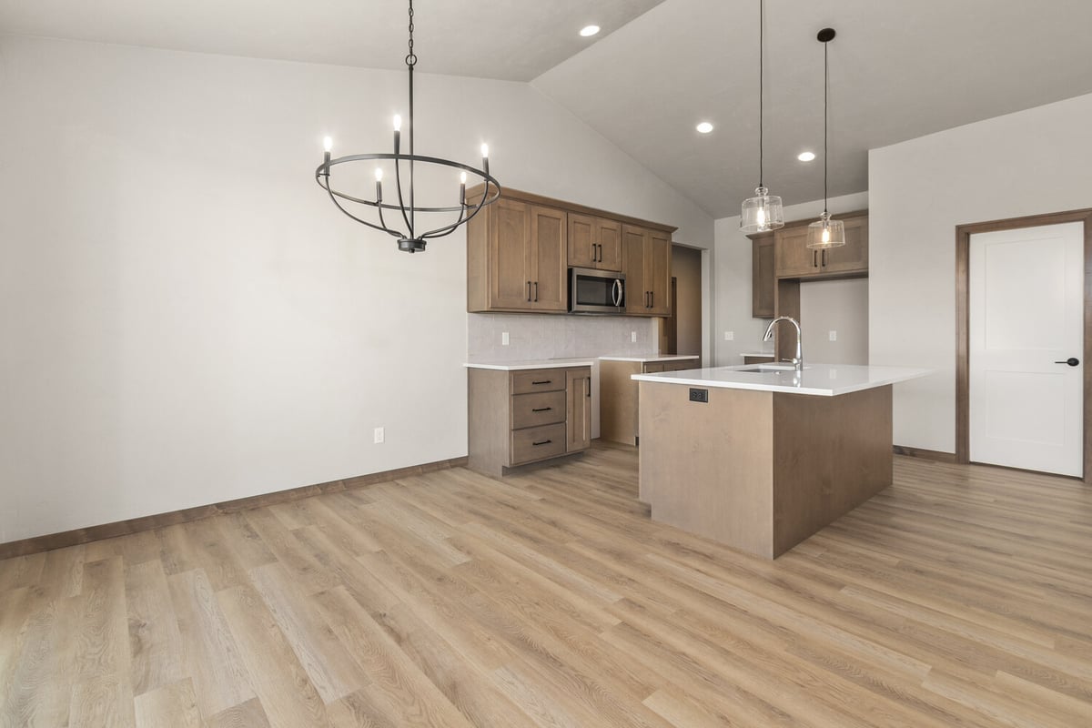 Kitchen and dining space in Kaukauna custom home by Midwest Design Homes