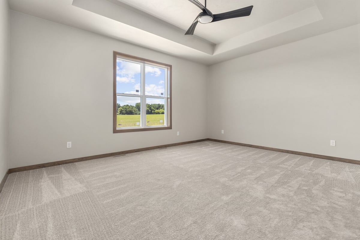 Master bedroom with tray ceiling and scenic view built by Midwest Design Homes in Neenah, WI