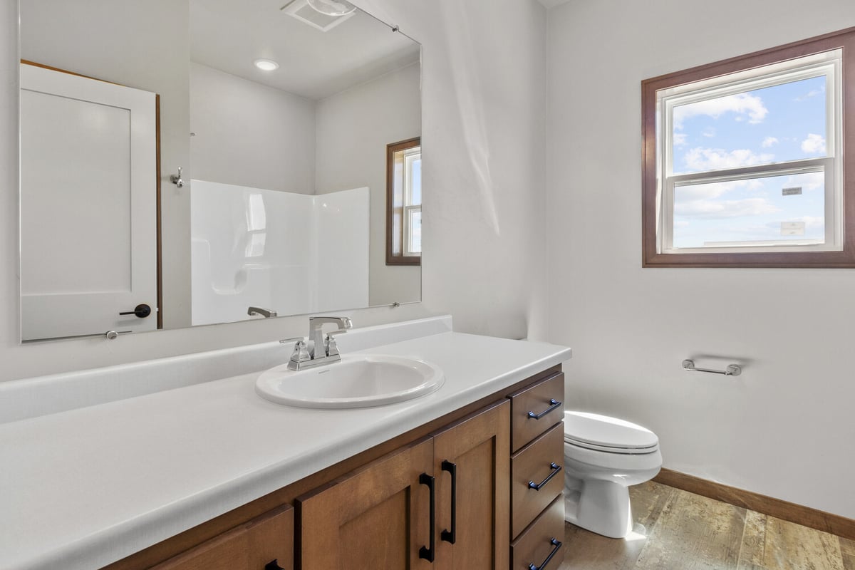 New bathroom interior with natural light in Ellington, WI home by Midwest Design Homes