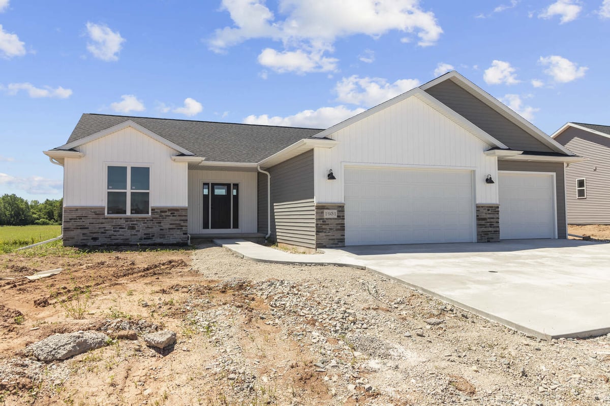 Newly constructed home with modern exterior finishes by Midwest Design Homes in Greenville, WI