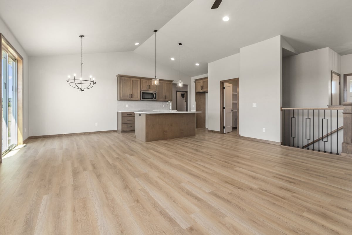 Spacious custom kitchen with island and vaulted ceilings in Fox Cities by Midwest Design Homes