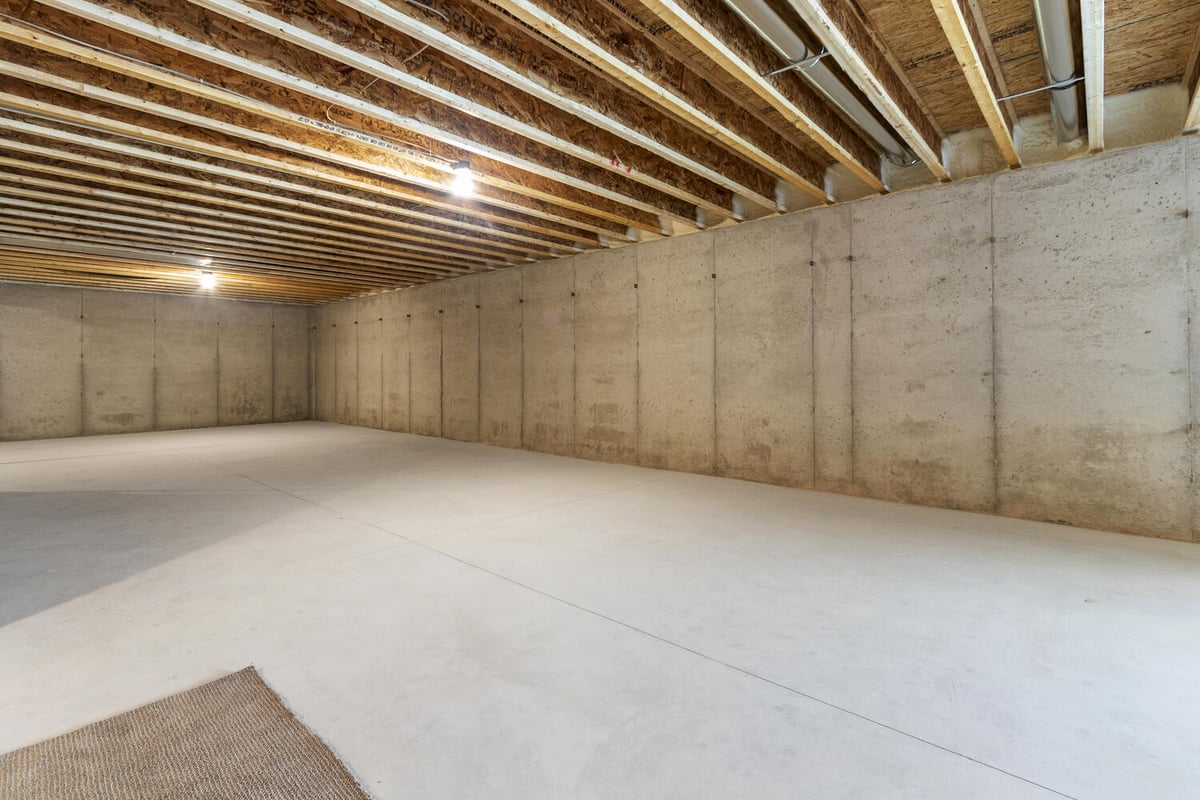 Wide concrete basement space under custom build by Midwest Design Homes in De Pere, WI