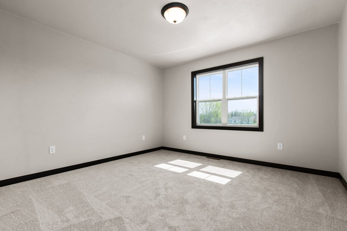 Cozy and bright custom bedroom design in a Fox Cities home by Midwest Design Homes