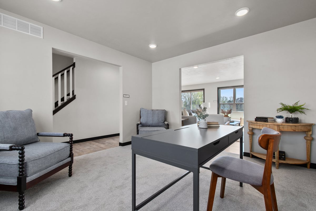 Modern home office with desk by Midwest Design Homes in Appleton, WI