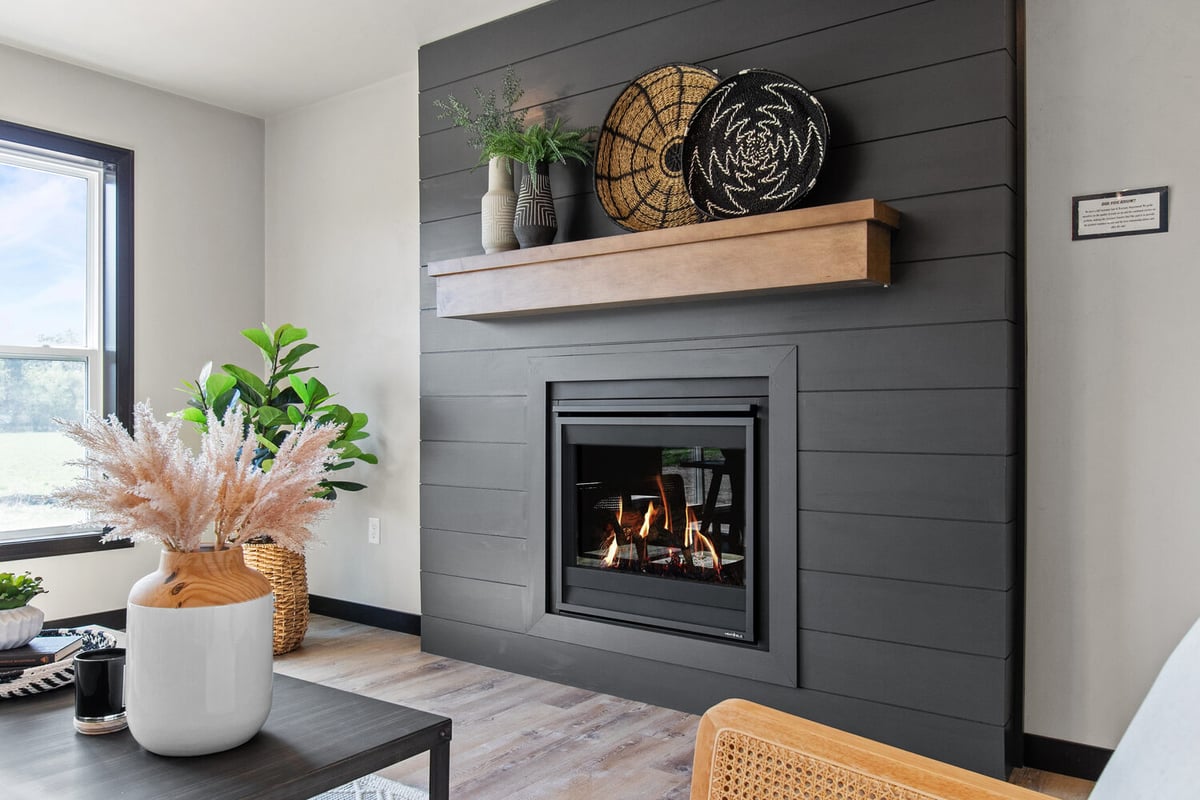 Modern shiplap fireplace in Wisconsin custom home by Midwest Design Homes