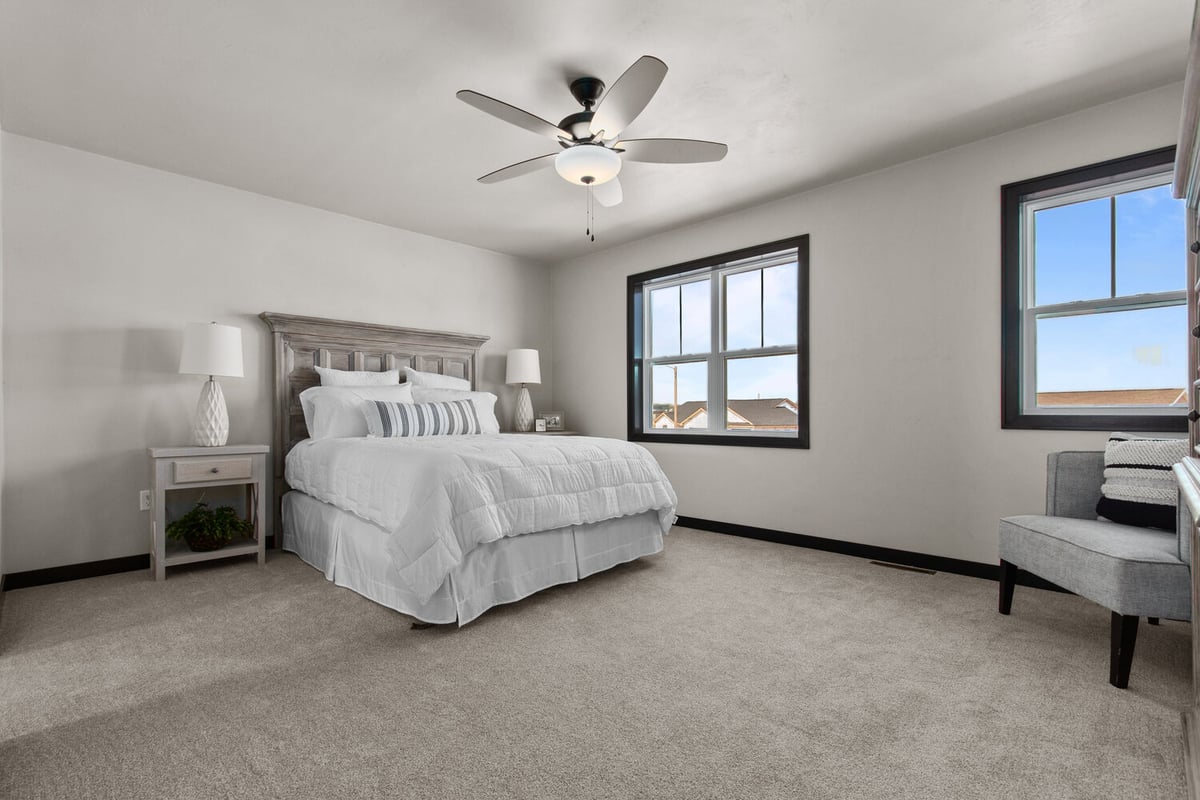 Natural light-filled bedroom by Midwest Design Homes in Neenah, Wisconsin