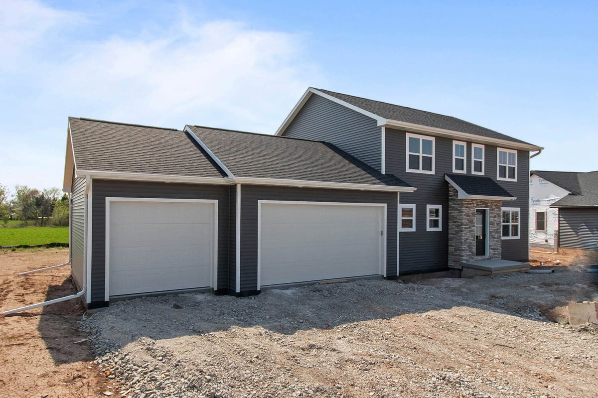 Newly constructed dark gray custom home exterior in Wisconsin by Midwest Design Homes