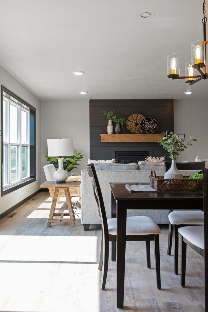 Open floor plan with fireplace and dining by Midwest Design Homes in Neenah, WI