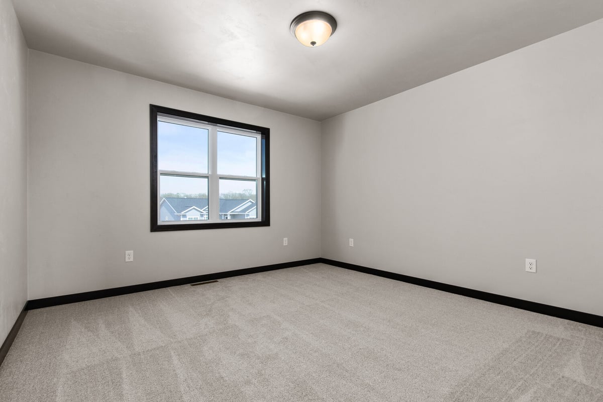 Spacious secondary bedroom design in a Fox Cities home by Midwest Design Homes