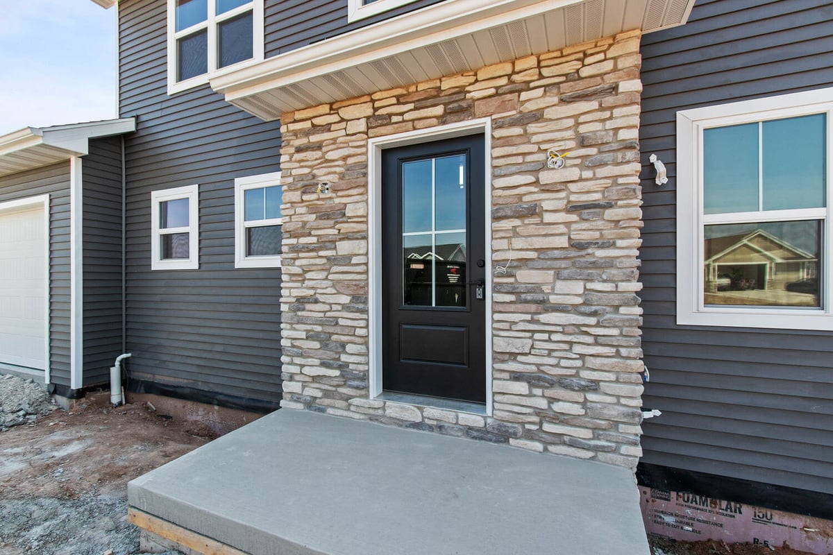 Stone-accented front entry of a custom-built home by Midwest Design Homes in Kaukauna, WI