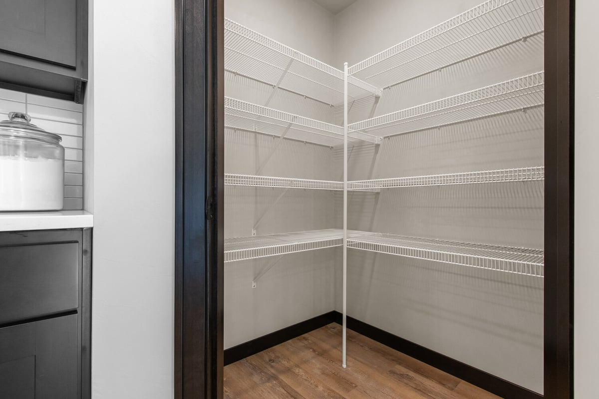 Walk-in pantry with shelving by Midwest Design Homes in Green Bay, Wisconsin