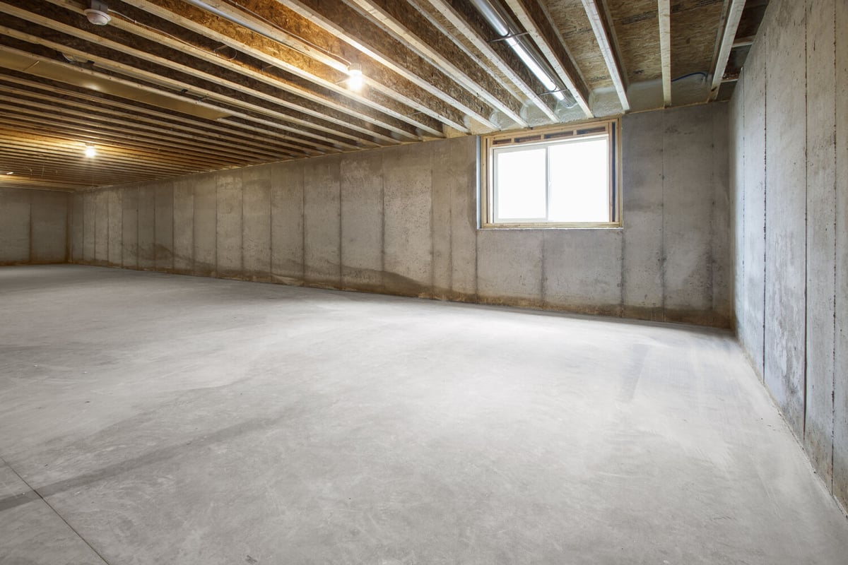 Basement with window in Wisconsin custom home by Midwest Design Homes