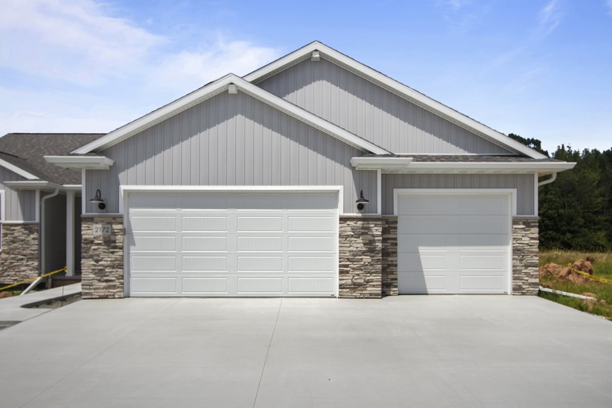 New home exterior in Fox Cities WI with garage by Midwest Design Homes