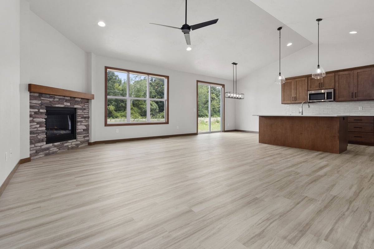 Open concept living room and kitchen in Wisconsin custom home by Midwest Design Homes