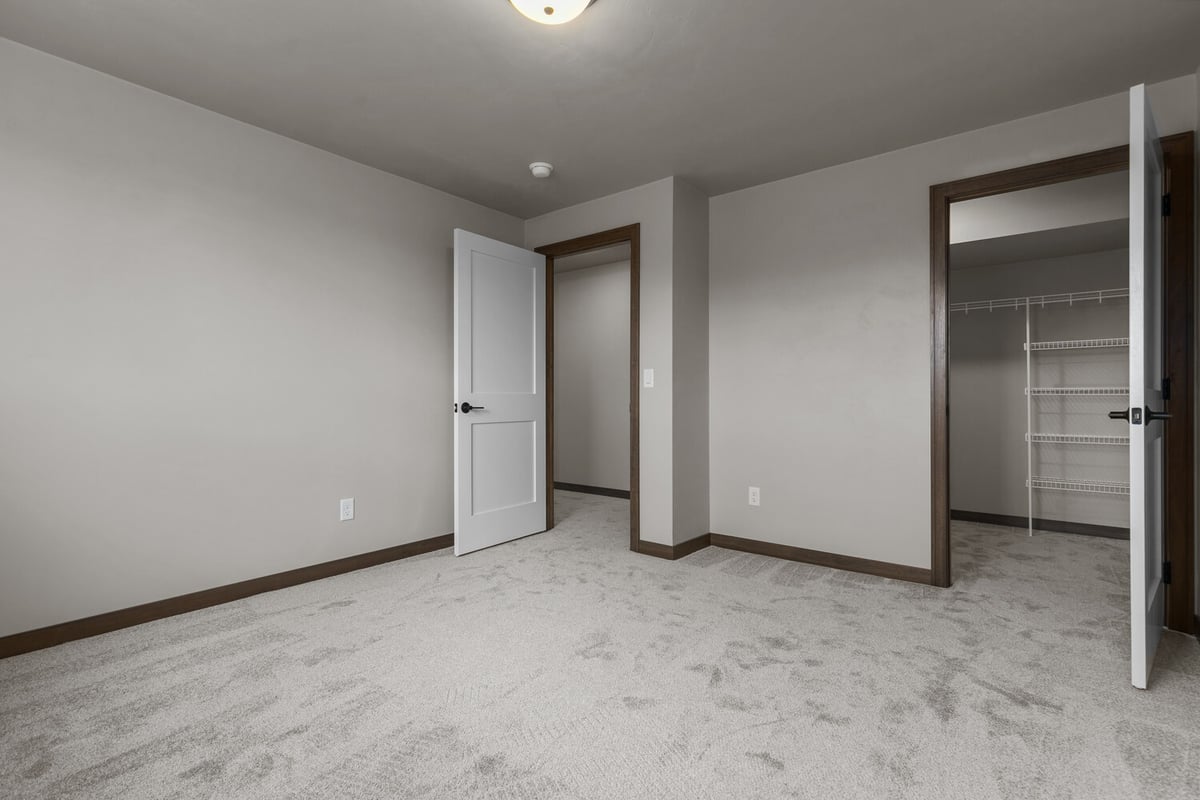 Custom bedroom with walk-in closet in Appleton WI by Midwest Design Homes