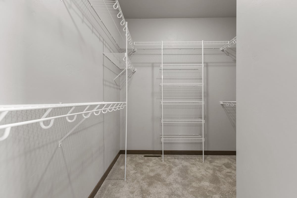 Wire-shelved walk-in closet in custom home by Midwest Design Homes in Kaukauna, Wisconsin