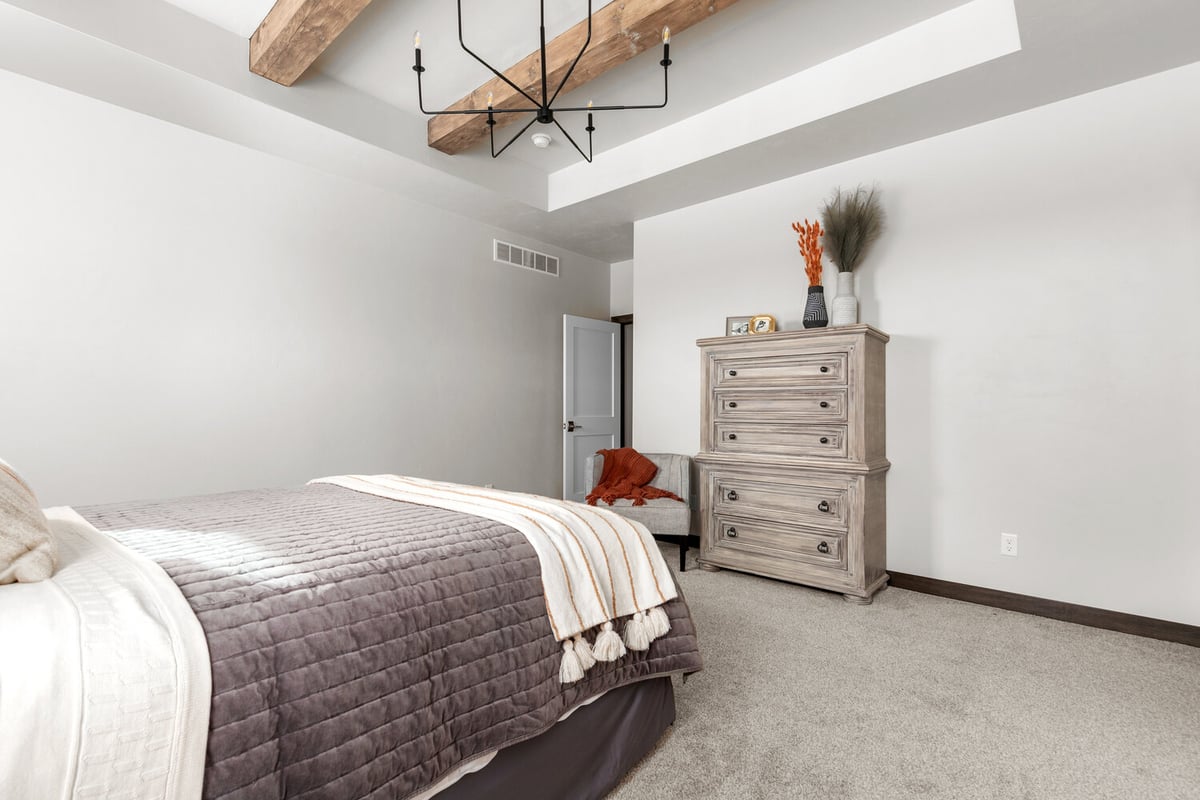 Custom bedroom with wood ceiling beams built by Midwest Design Homes in Appleton, WI
