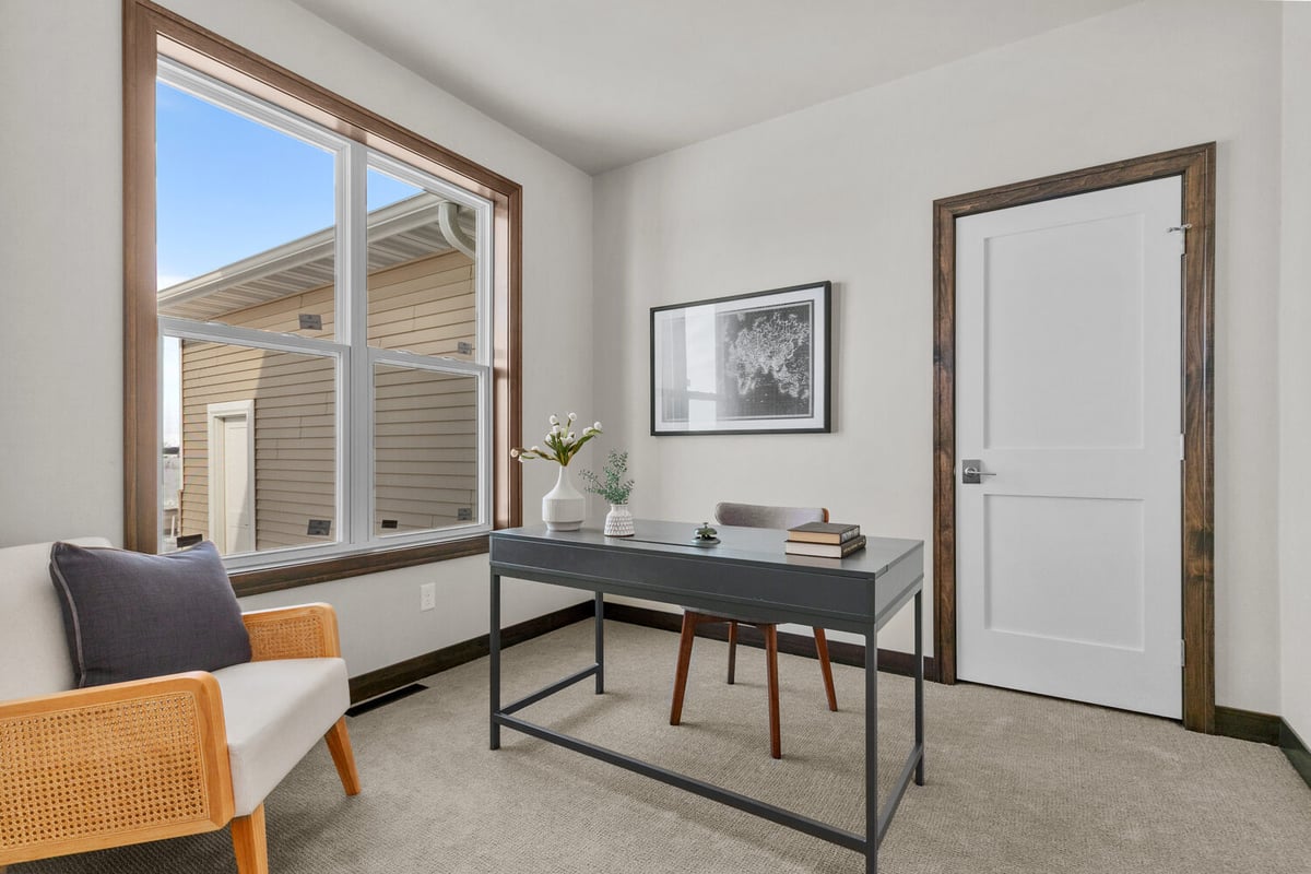 Custom home office with large window by Midwest Design Homes in Fox Cities, WI