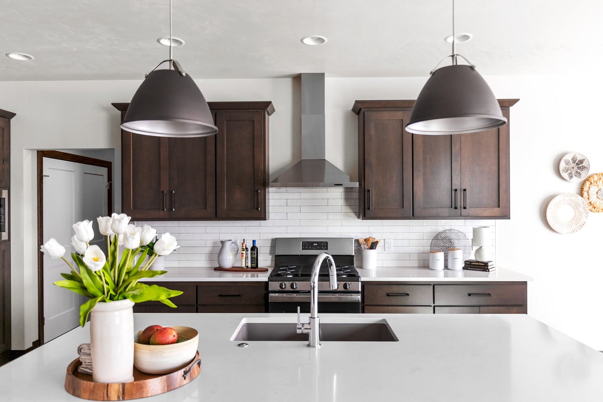 Custom kitchen with dark cabinets and white quartz by Midwest Design Homes in Kaukauna, WI