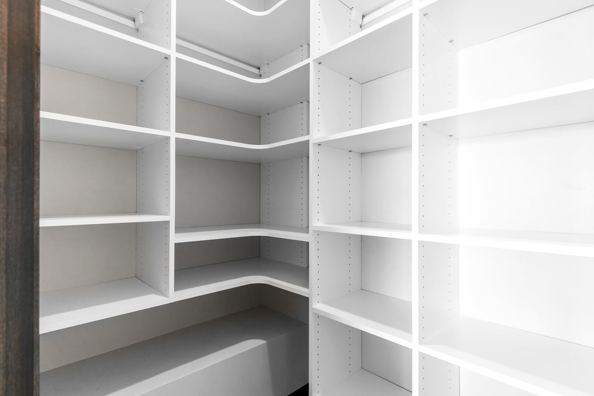 Custom walk-in closet with shelving by Midwest Design Homes in Appleton, WI