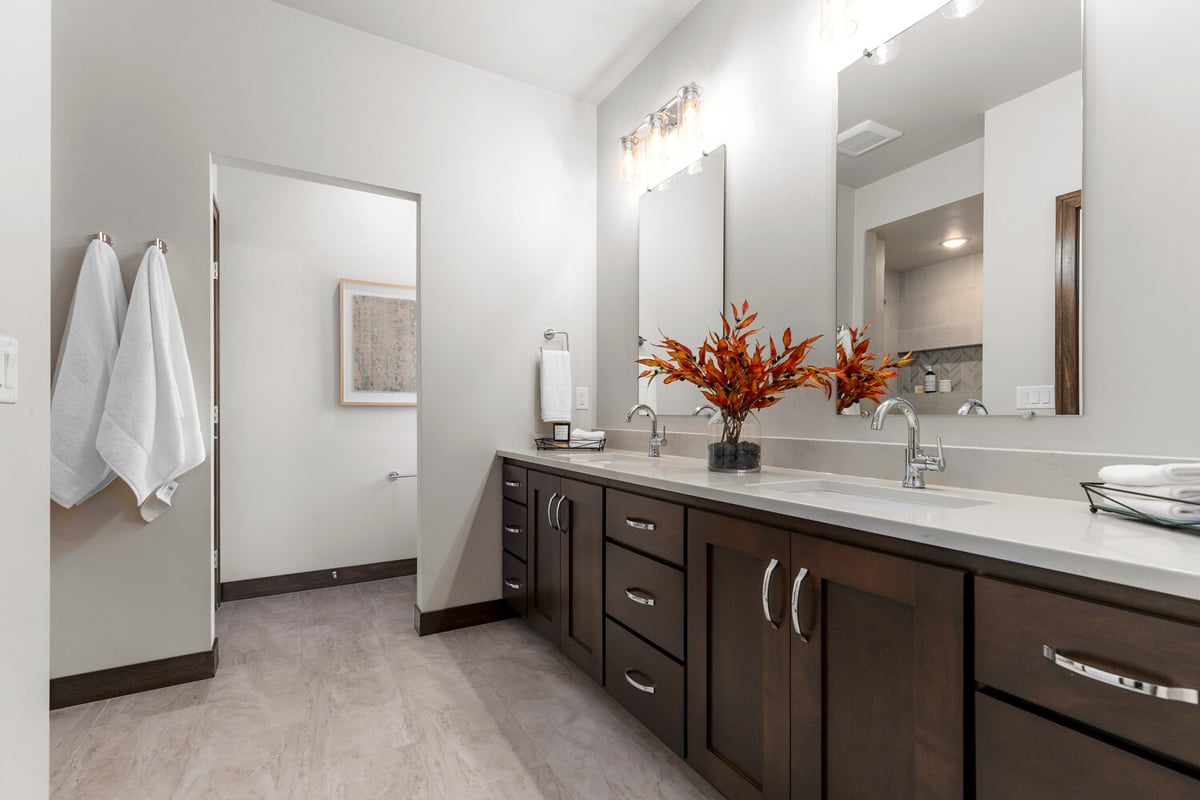 Double vanity with quartz counters in Kaukauna custom home by Midwest Design Homes