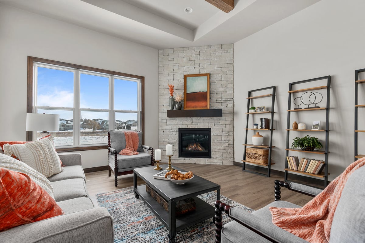 Fireplace with stone surround and shelves by Midwest Design Homes in Bellevue, WI