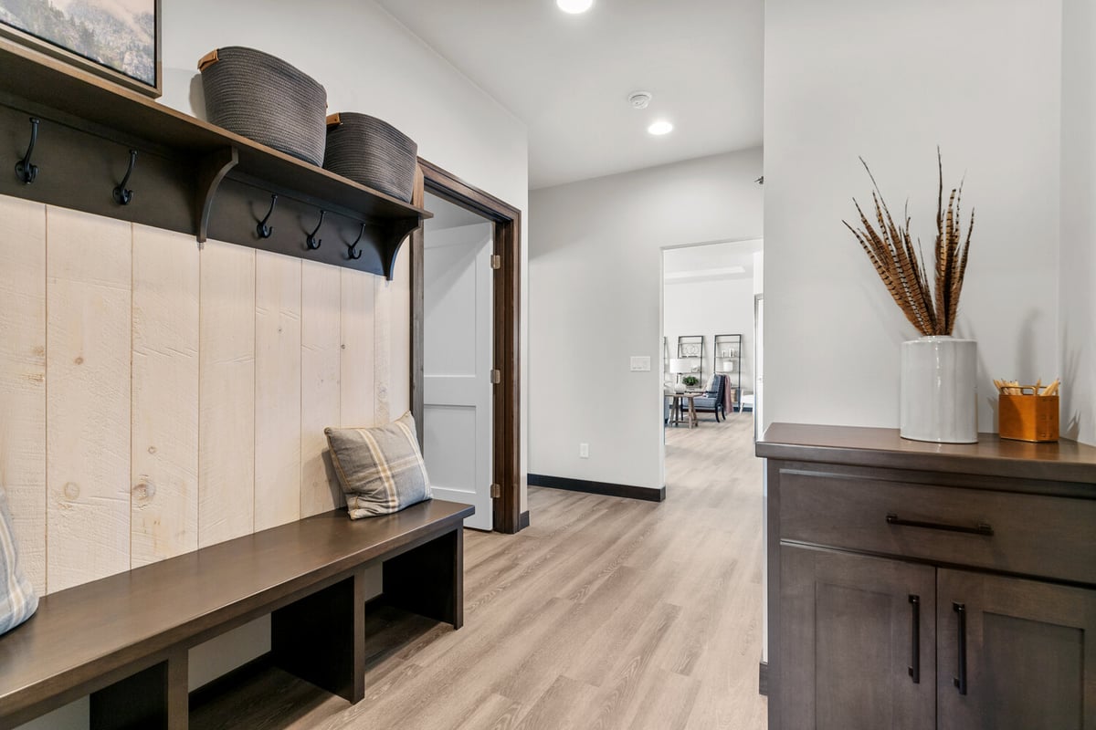 Mudroom with bench and hooks by Midwest Design Homes in custom Kaukauna home