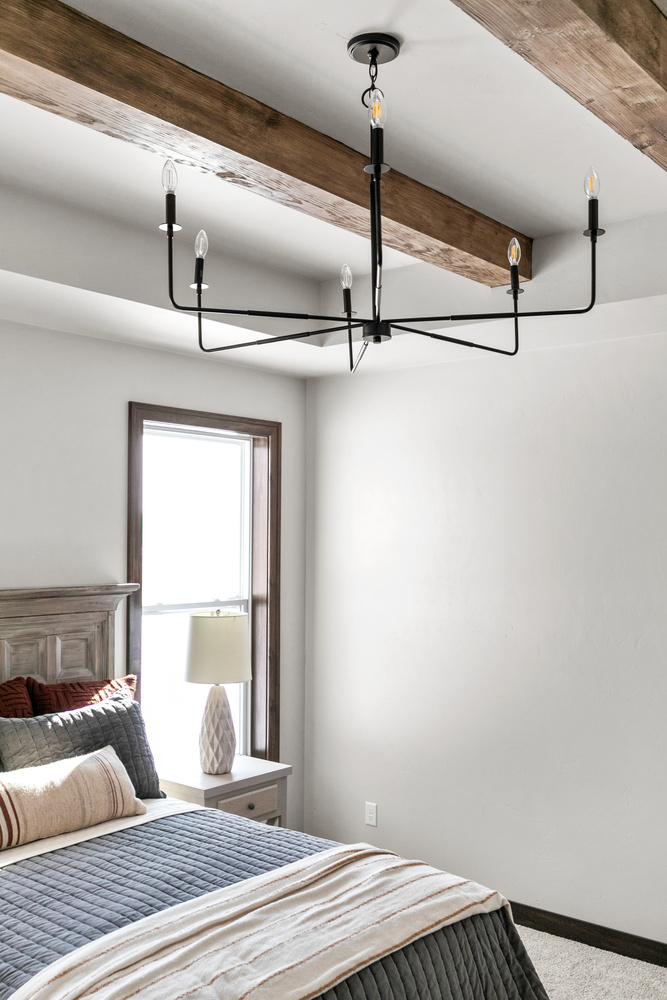 Rustic bedroom ceiling detail in Kaukauna custom home by Midwest Design Homes