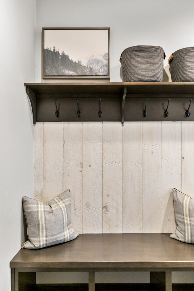 Wood bench and cubbies in mudroom of custom home by Midwest Design Homes in Kaukauna