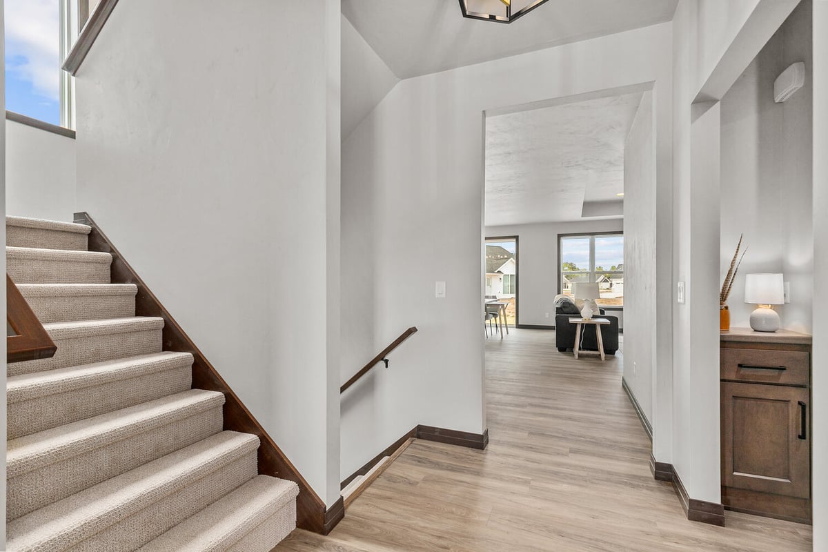 Custom stairway and open hallway by Midwest Design Homes in Harrison, WI