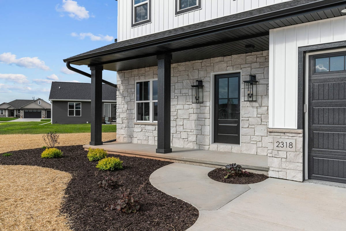 Entry with modern columns on custom home by Midwest Design Homes in Wisconsin neighborhood