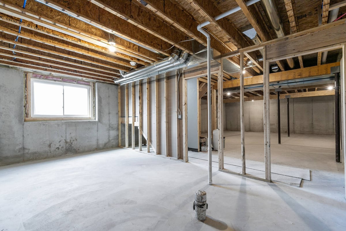 Framed basement under construction in Wisconsin custom home by Midwest Design Homes