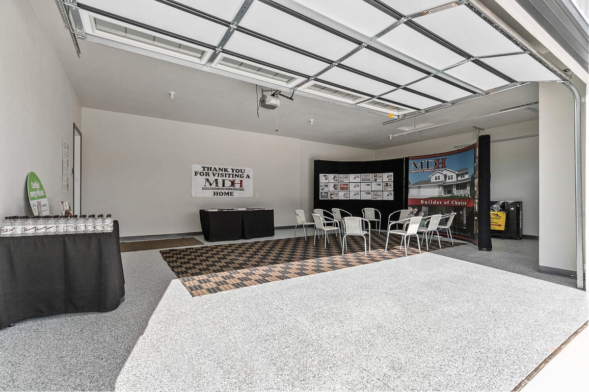 Garage model home display area for Midwest Design Homes in Wisconsin community