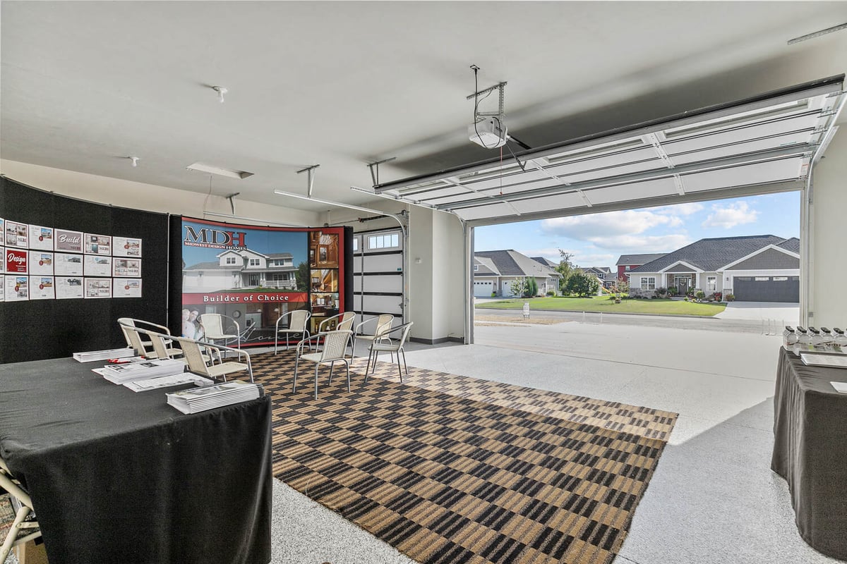 Garage showroom with Midwest Design Homes branding in new Wisconsin custom home