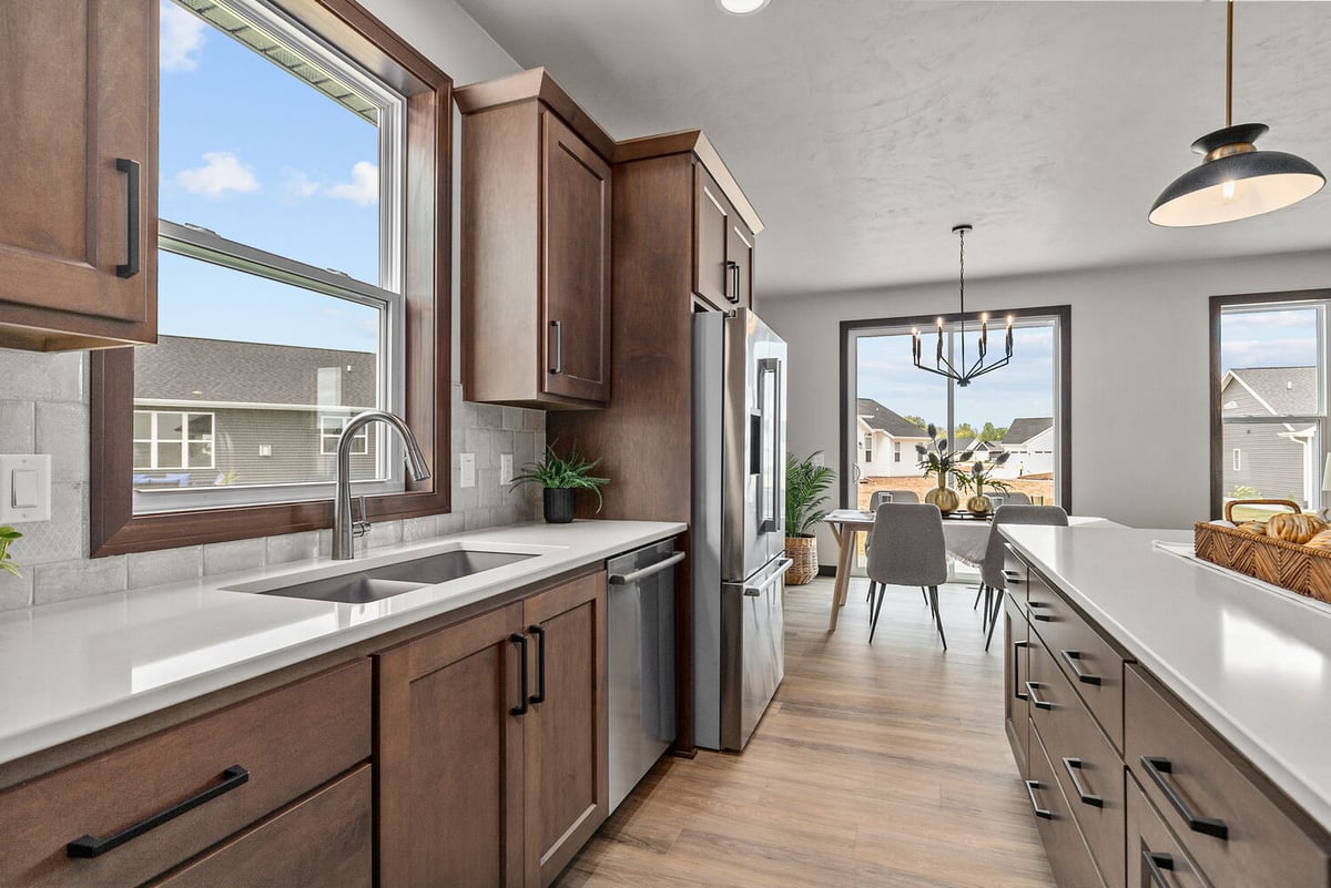 Kitchen sink with large window in custom Bellevue, WI home by Midwest Design Homes