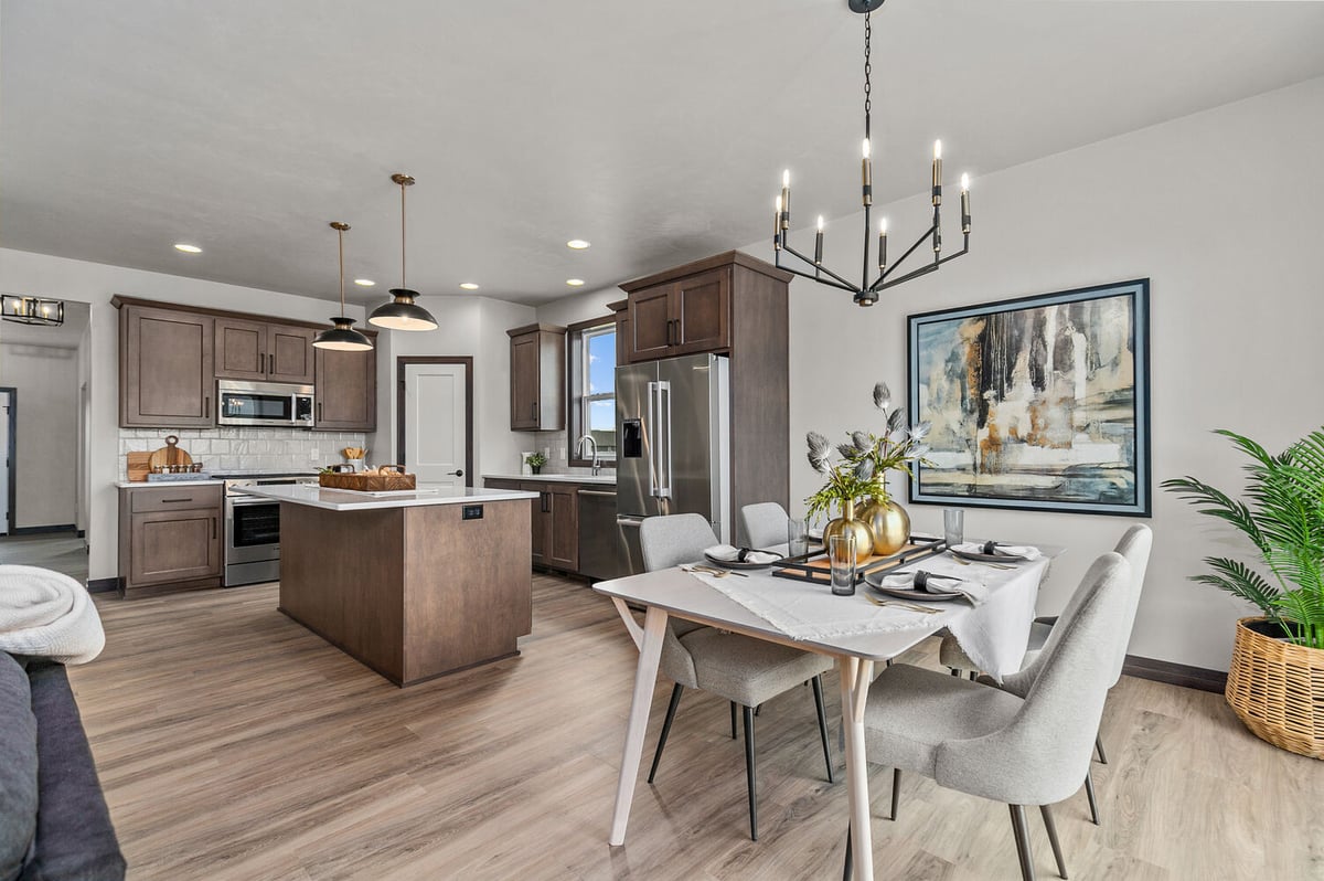 Open kitchen and dining space by Midwest Design Homes in Harrison, WI custom home